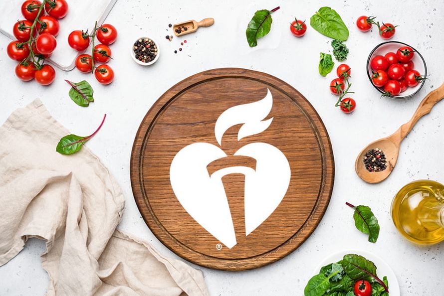 cutting board with aha logo and vegetables cutting board with aha logo and vegetables